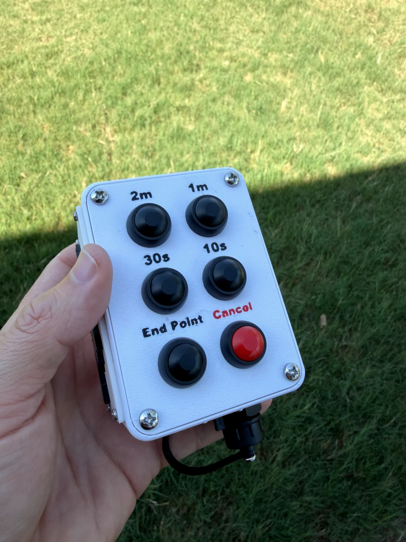 PT-Core professional paintball timer held outdoors